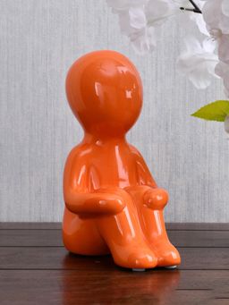 At Home by Nilkamal - Boy Sitting with Folded Legs Polyresin Decorative Showpiece (Orange)