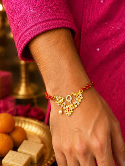 Digital Dress Room - Q Letter Bird Pearl and Stone Design Rakhi