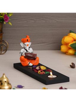 eCraftIndia - Polyresin Ganesha Playing Dholak Showpiece with wooden Base, Petals & Tealight