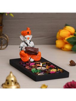 eCraftIndia - Ganesha Playing Dholak Showpiece with wooden Base Plate, Petals & Tealight