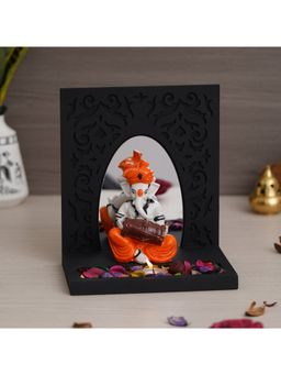 eCraftIndia - Ganesha Playing Dholak Showpiece with wooden Base Plate, Petals & Tealight