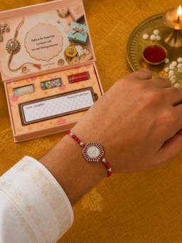 SAMIKA - 999 Pure Silver Khatu Coin Rakhi Hamper with Mukhwas, Roli and Chawal