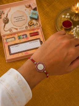 SAMIKA - 999 Pure Silver Lotus Coin Rakhi Hamper with Mukhwas, Roli and Chawal