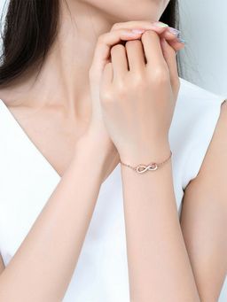 Yellow Chimes - Gold Toned Infinity Shape Crystal Studded Charming Bracelet