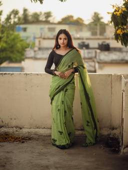 Aparna - Green Soft Mul Cotton Saree with Quirky Black Doodle Print