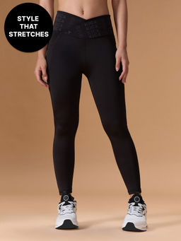 Kica - Mid Rise Criss Cross Leggings in Sculpting Stretch Kica SKN Fabric Black