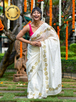 Suta - White and gold-toned Ready To Wear Saree.