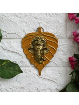 eCraftIndia - Yellow and Golden Lord Ganesha Face On Leaf Wall Hanging Decorative Showpiece