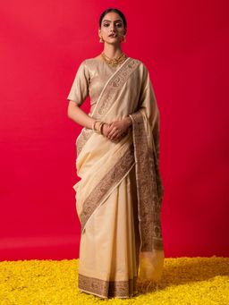 Triyah - The Royal Cream Muga Silk Saree With Unstitched Blouse Fabric