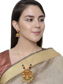 Anika's Creations - Antique Matte Gold Finish Goddess Laxmi Green Stone Studded Temple Jewellery Set