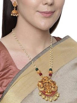 Anika's Creations - Antique Matte Gold Finish Goddess Laxmi Pink Stone Studded Temple Jewellery Set