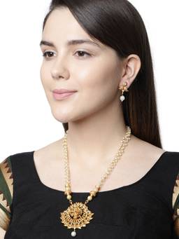 Anika's Creations - Antique Matte Gold Finish God Krishna White Stone Studded Temple Jewellery Set