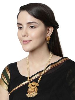 Anika's Creations - Antique Matte Gold Finish Goddess Laxmi Green Stone Studded Temple Jewellery Set