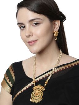 Anika's Creations - Antique Matte Gold Finish Goddess Laxmi Green Stone Studded Temple Jewellery Set