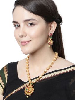 Anika's Creations - Antique Matte Gold Finish Green Stone Studded Temple Jewellery Set