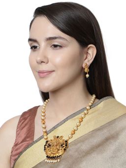 Anika's Creations - Antique Matte Gold Finish Goddess Laxmi Black Stone Studded Temple Jewellery Set