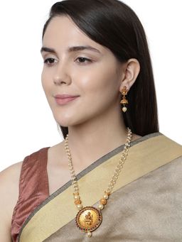 Anika's Creations - Antique Matte Gold Finish Goddess Laxmi Green Stone Studded Temple Jewellery Set