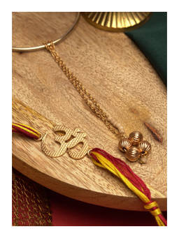 Suhani Pittie - Divine 22K Gold Plated Om Rakhi With Red And Yellow Tieups & Lumba Rakhi Set