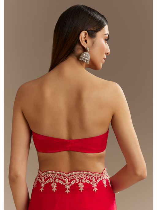 kalki red dress Deep Red Embellished Trail Gown A silhouette steeped in allure, this deep wine creation fuses mystery with command. The sculpted bodice embraces the form like armor, while the daring slit adds a