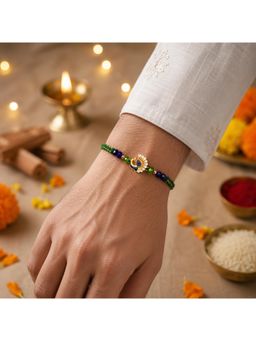 SHILLYN - Royal Mayur Gold-Plated Peacock Rakhi In Forest Green