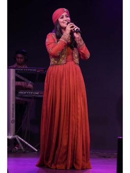 STUDIO BAGECHAA - Harshdeep Kaur In Madhavi Brick Red Anarkali Dress with Mughal Embroidery