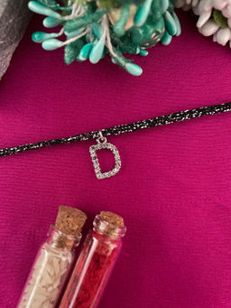 Digital Dress Room - D Letter Silver Plated AD Initial Black Thread Rakhi with Roli Chawal