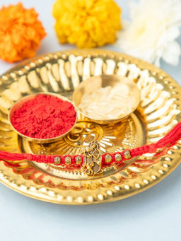 Niscka - Gold Plated Lord Krishna Rakhi with Roli Chawal