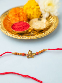 Niscka - Red Gold Plated Lord Krishna Rakhi with Roli Chawal