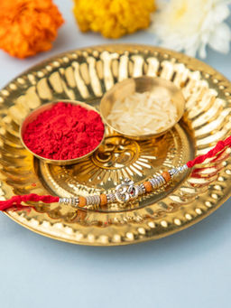 Niscka - Red Silver Plated Om Rakhi with Roli Chawal