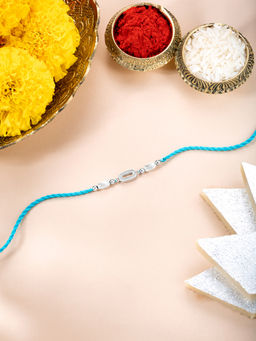 Peora - Sterling Silver Rakhi In Green Thread with Roli Chawal & Greeting Card