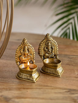 ExclusiveLane - Hand Carved Laxmi Ganesha Pair Brass Diyas