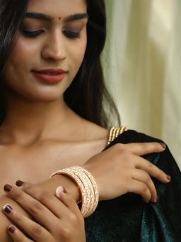 Adwitiya - Women Gold Plated Cream Stone Studded Bangles (Set of 4)