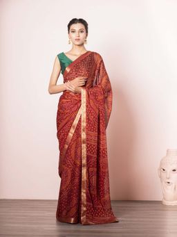 EXCLUSIVA - Red Blended Chiffon Bandhani Print Saree with Unstitched Blouse