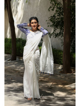 Moora - Twirl In Pearl White Mulmul Cotton Saree With Tassels with Unstitched Blouse