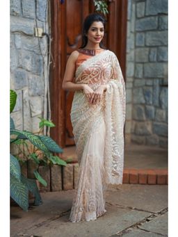 Shobitam - Light Champagne Color Swirl Design Sequins On Net Saree With Unstitched Blouse