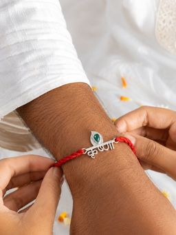 Dulcett - Green Plated Krishna Green Stone Rakhi