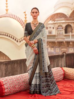 Elora - Off white Poly Viscose Silk Ikkat Printed Patola Saree with Black weaving Border
