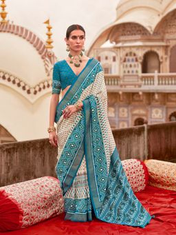 Elora - Off white Poly Viscose Silk Ikkat Printed Patola Saree with Sea Blue weaving Border