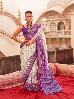 Elora - Off white Poly Viscose Silk Ikkat Printed Patola Saree with Plum weaving Border