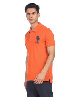 U.S. POLO ASSN. - Men Orange Cotton Solid Polo T-shirt