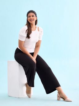 Go Colors - Women Black Solid Knit Viscose Mid Rise Palazzos