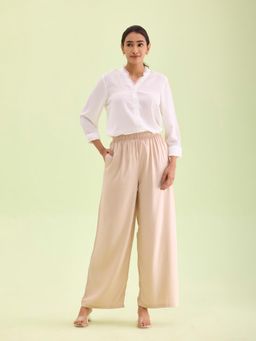 Go Colors - Women Light Beige Solid Viscose Knit Mid Rise Palazzos