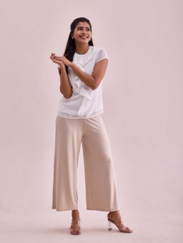 Go Colors - Women Solid Light Beige Viscose Mid Rise Knit Palazzo