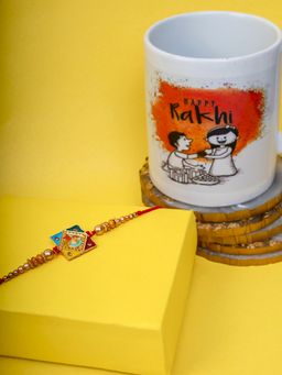 PANASH - Gold-Plated Multicolored Square Shaped Krishna Thread Rakhi With Mug & Roli Chawal (Set of 4)