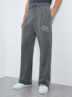 Styli - Men Acid Wash Pleated Oversize Track Pant with Front and Back Embroidery - Grey