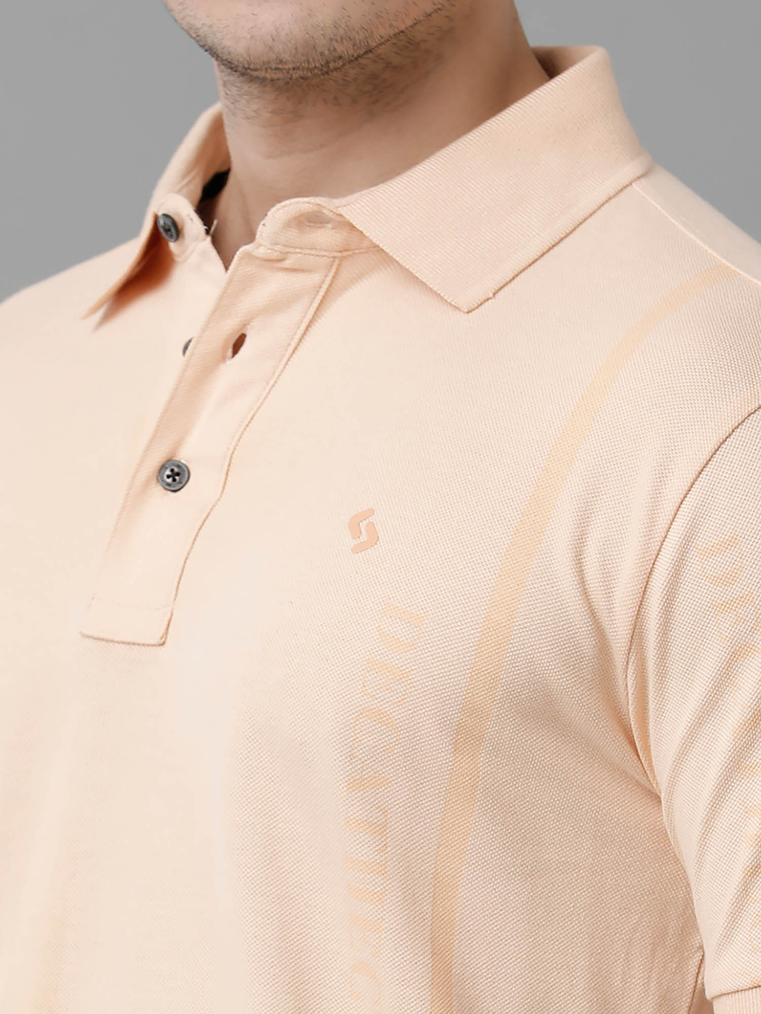 cream colored polo shirt