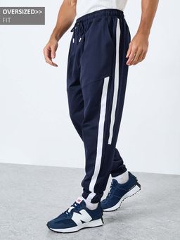 Styli - Men Navy Blue Stripes Twill Tape Oversize Joggers