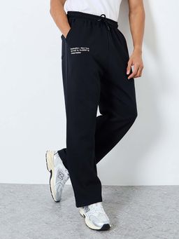Styli - Men Black Minimal Text Printed Relaxed Fit Trackpant