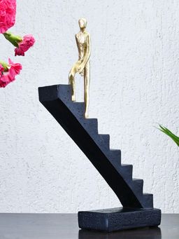 At Home by Nilkamal - Man Climbing Stairs Decorative Polyresin Showpiece (Black & Gold)