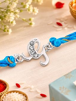Estele - Rhodium Plated Artistic G Initials Rakhi With Austrian Crystals & Fancy Silk Thread